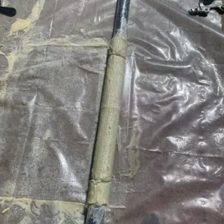 No-dig patch repair being prepared for installation in damaged drainage pipework