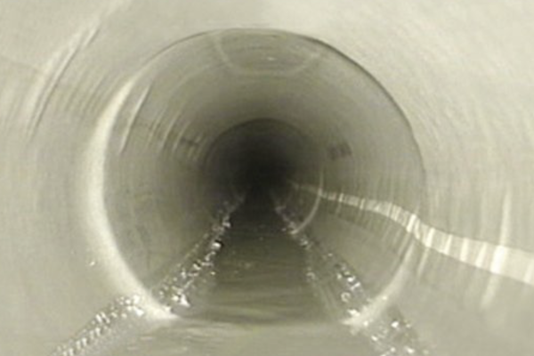 Completed internal patch repair visible inside drainage pipework
