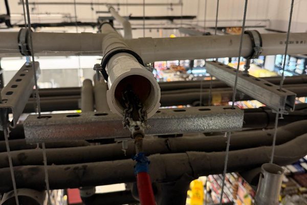 Photo documenting specialist drainage access and clearance at a Perth supermarket