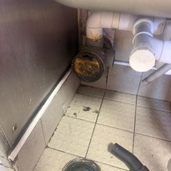 Grease build-up blocking a drainage pipe