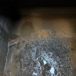 Rubble blocking a drainage manhole